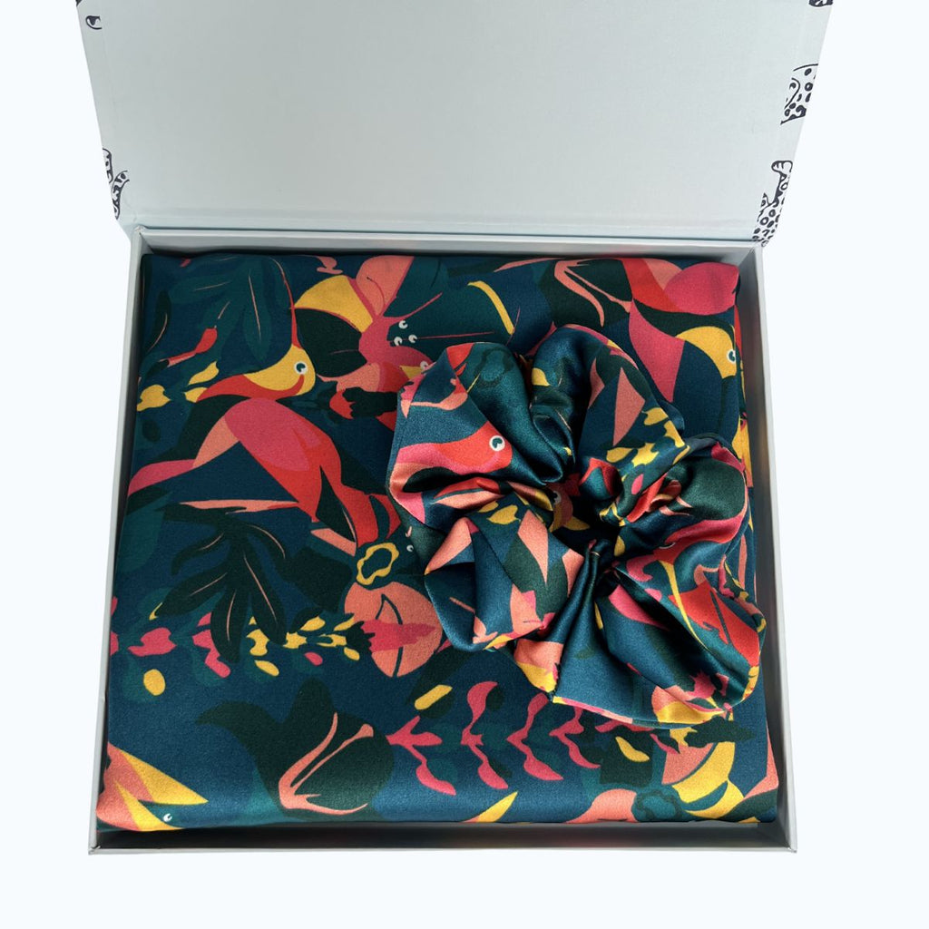 Lively hummingbird silk pillowcase and scrunchie in a presentation box on a white background