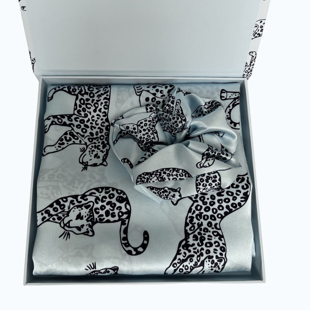 MYRN Blue Leopard Silk Pillowcase in a box with a matching large silk scrunchie on a white background