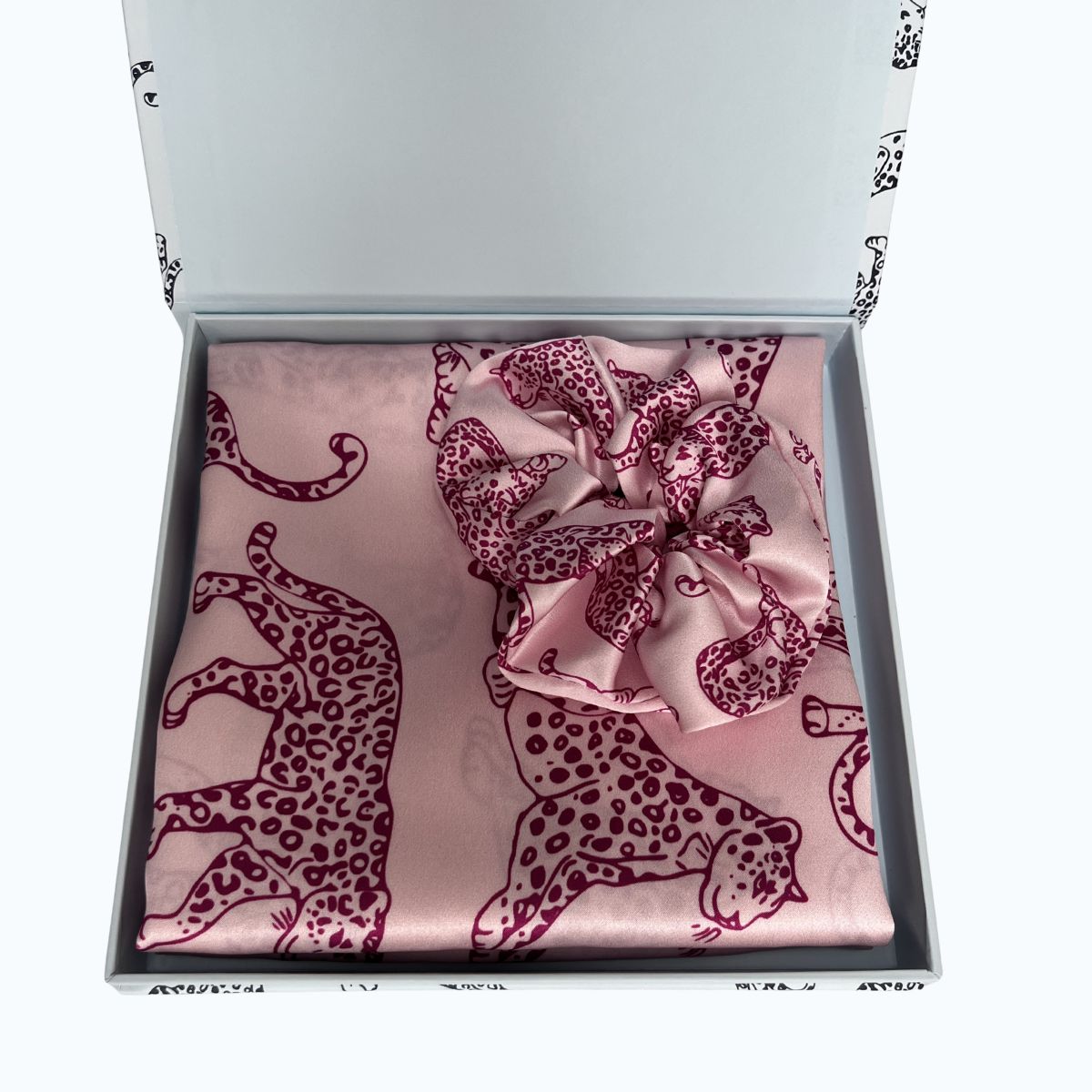 MYRN Pink Leopard Printed Pillowcase and large silk scrunchie in a presentation box on a white background.