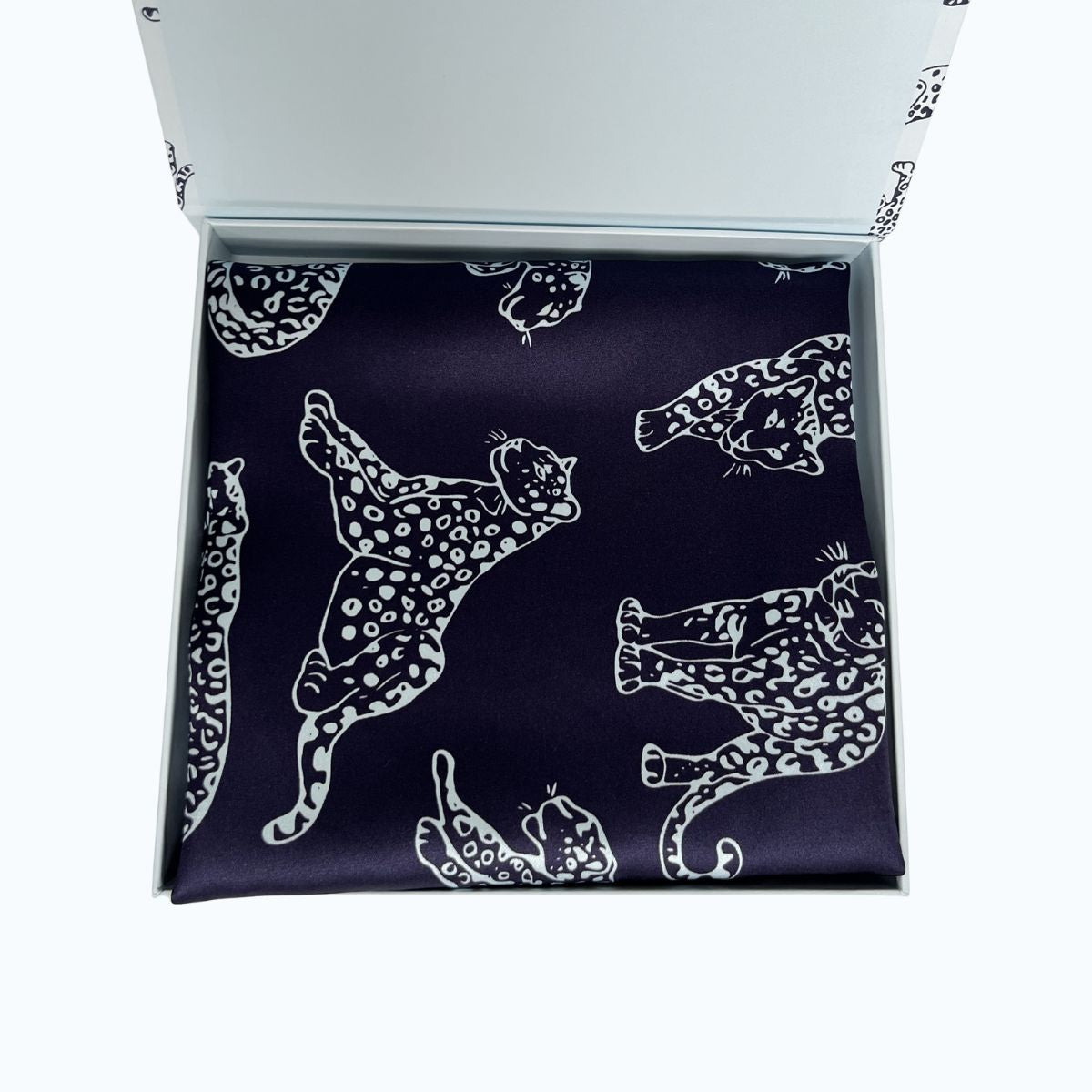 MYRN Midnight Blue leopard printed silk pillowcase in a presentation box on a white background