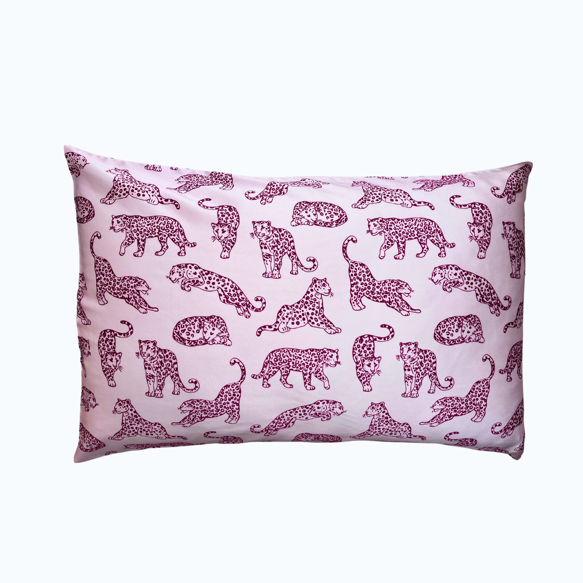 Light pink leopard printed silk pillowcase on a white background